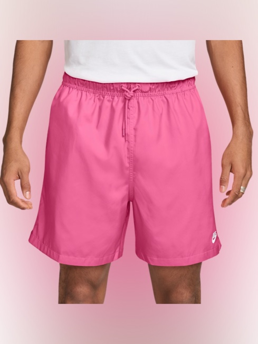 Small Nike Men’s Club Woven Flow Shorts. Color is Playful Pink